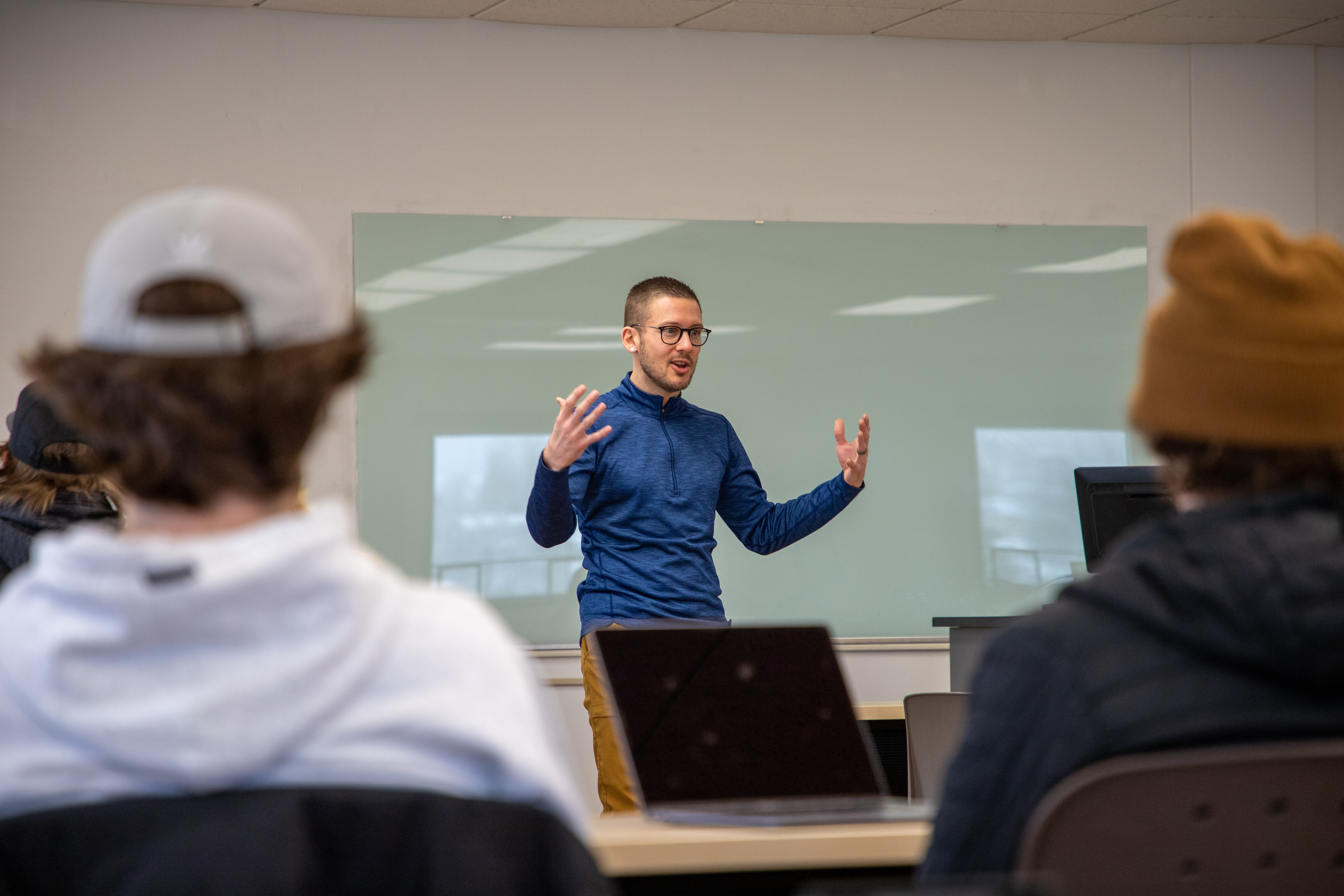 Dr. Trenton Ellis lectures in a Sociology class.