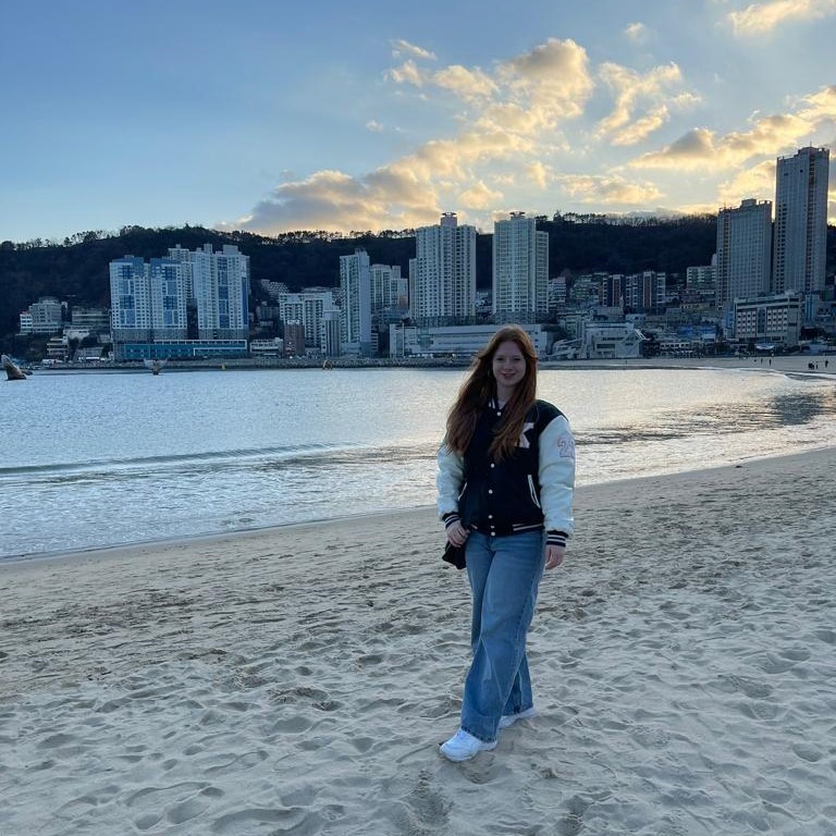 Karanda Kay Davis poses for a photo on a beach in South Korea.
