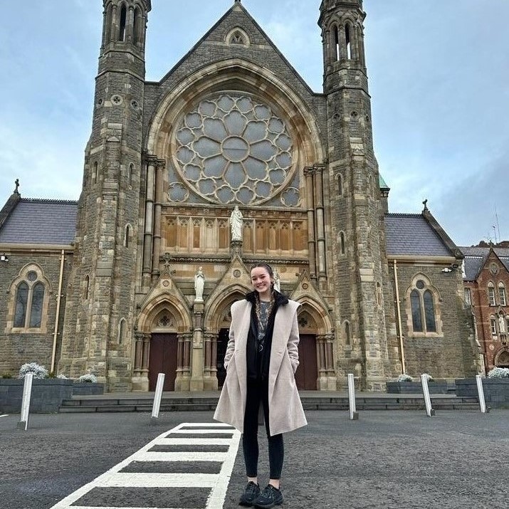 A BHSU student poses infront of the Clonard Monastery in Belfast, Ireland.