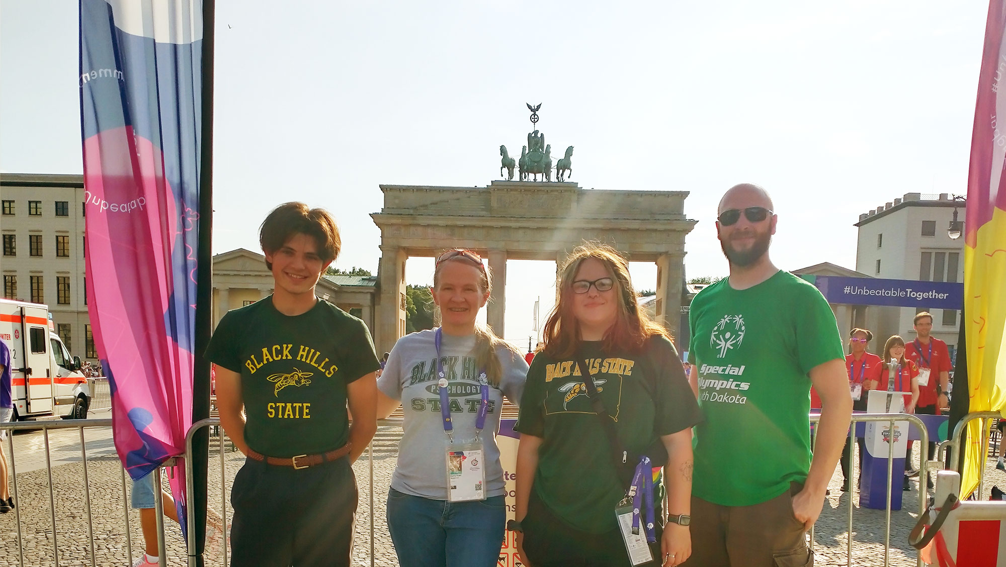 Jack Wenger, Dr. Emilia Flint, Fey Famirez, and Timothy Brooks pose for a photo together at the Special Olympics in Berlin, Germany.